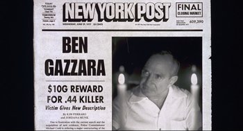 Movie still from “Summer of Sam” (1999), directed by Spike Lee – A newspaper with a picture of a man on the front page; Medium shot, High angle