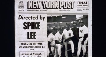 Movie still from “Summer of Sam” (1999), directed by Spike Lee – A group of baseball players are posing for a picture; Wide shot, Low angle