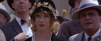 Movie still from “Sunset” (1988), directed by Blake Edwards – A person wearing a hat; Close Up shot, Over the shoulder angle