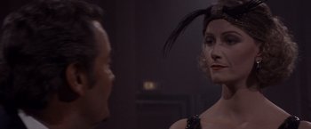 Movie still from “Sunset” (1988), directed by Blake Edwards – A man and a woman are looking at one another in the mirror; Close Up shot, Over the shoulder angle