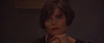Movie still from “Sunset” (1988), directed by Blake Edwards – A person with short brown hair; Close Up shot, High angle