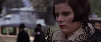 Movie still from “Sunset” (1988), directed by Blake Edwards – A person wearing a veil; Close Up shot, Over the shoulder angle