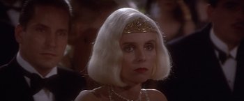 Movie still from “Sunset” (1988), directed by Blake Edwards – A person wearing a tiara; Close Up shot, Over the shoulder angle
