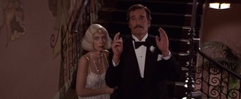 Movie still from “Sunset” (1988), directed by Blake Edwards – A man and a woman dressed up in formal wear; Medium shot, Low angle