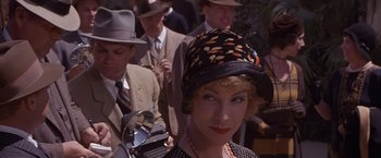 Movie still from “Sunset” (1988), directed by Blake Edwards – A woman wearing a hat and a polka dot dress; Close Up shot, Low angle