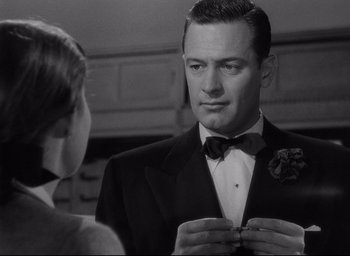 Movie still from “Sunset Blvd.” (1950), directed by Billy Wilder – A black and white photo of a man and a woman; Close Up shot, Over the shoulder angle