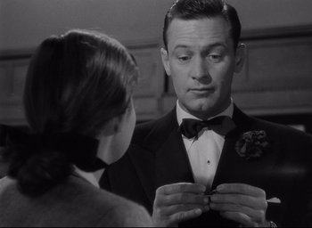 Movie still from “Sunset Blvd.” (1950), directed by Billy Wilder – A man and a woman looking at each other in front of a mirror; Close Up shot, Over the shoulder angle