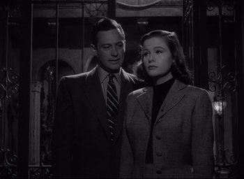 Movie still from “Sunset Blvd.” (1950), directed by Billy Wilder – A man and a woman standing next to each other; Medium shot, Low angle