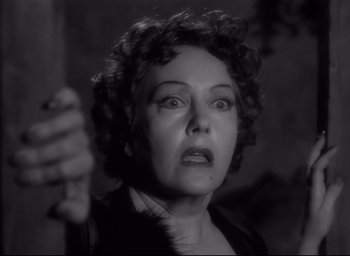 Movie still from “Sunset Blvd.” (1950), directed by Billy Wilder – An old woman is looking at the camera; Close Up shot, Over the shoulder angle