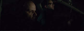 Movie still from “Suntan” (2016), directed by Argyris Papadimitropoulos – Two men in the dark looking into the distance; Close Up shot, Over the shoulder angle