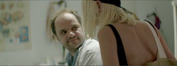 Movie still from “Suntan” (2016), directed by Argyris Papadimitropoulos – A man and a woman are talking to each other; Close Up shot, Over the shoulder angle