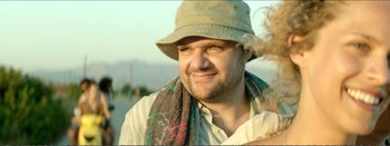 Movie still from “Suntan” (2016), directed by Argyris Papadimitropoulos – A person wearing a hat; Close Up shot, Low angle