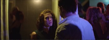 Movie still from “Suntan” (2016), directed by Argyris Papadimitropoulos – A man and a woman looking at one another in a mirror; Medium shot, Over the shoulder angle