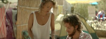 Movie still from “Suntan” (2016), directed by Argyris Papadimitropoulos – A man and a woman standing next to each other; Medium shot, Over the shoulder angle