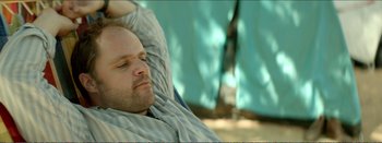 Movie still from “Suntan” (2016), directed by Argyris Papadimitropoulos – A person laying in a bed; Close Up shot, Over the shoulder angle