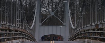Movie still from “Super Dark Times” (2017), directed by Kevin Phillips – A group of people standing on top of a metal bridge; Extreme Wide shot, High angle