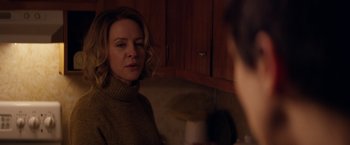 Movie still from “Super Dark Times” (2017), directed by Kevin Phillips – A woman in a brown sweater is looking at a man in a brown sweater; Close Up shot, Over the shoulder angle