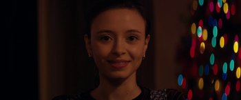 Movie still from “Super Dark Times” (2017), directed by Kevin Phillips – A person smiling for the camera; Close Up shot, Over the shoulder angle