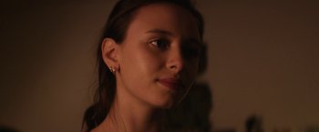 Movie still from “Super Dark Times” (2017), directed by Kevin Phillips – A woman's face in the dark; Close Up shot, Over the shoulder angle