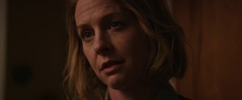 Movie still from “Super Dark Times” (2017), directed by Kevin Phillips – A woman's face in the dark; Close Up shot, Over the shoulder angle