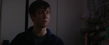 Movie still from “Super Dark Times” (2017), directed by Kevin Phillips – A young man is looking into the distance; Close Up shot, Over the shoulder angle