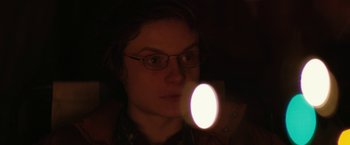 Movie still from “Super Dark Times” (2017), directed by Kevin Phillips – A person with a flashlight in a dark room; Close Up shot, Over the shoulder angle