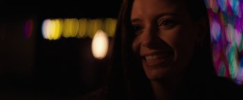 Movie still from “Super Dark Times” (2017), directed by Kevin Phillips – A person smiling at the camera; Close Up shot, Over the shoulder angle