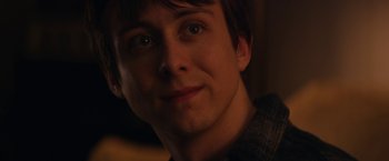 Movie still from “Super Dark Times” (2017), directed by Kevin Phillips – A young man's face in the dark; Close Up shot, Over the shoulder angle