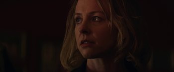 Movie still from “Super Dark Times” (2017), directed by Kevin Phillips – A woman's face in the dark; Close Up shot, Low angle