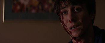 Movie still from “Super Dark Times” (2017), directed by Kevin Phillips – A young boy with blood on his face; Close Up shot, Over the shoulder angle