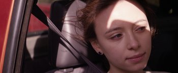 Movie still from “Super Dark Times” (2017), directed by Kevin Phillips – A woman's face in the back seat of a car; Close Up shot, High angle