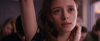 Movie still from “Super Dark Times” (2017), directed by Kevin Phillips – A woman's face and arm; Close Up shot, Low angle