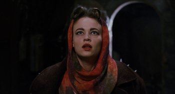 Movie still from “Super Mario Bros.” (1993), directed by Annabel Jankel – A person wearing a scarf; Close Up shot, Low angle