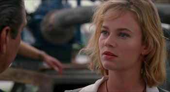 Movie still from “Super Mario Bros.” (1993), directed by Annabel Jankel – A person wearing a white shirt; Close Up shot, Low angle