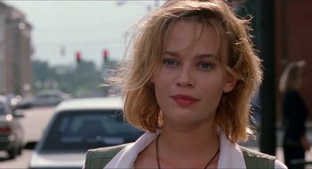 Movie still from “Super Mario Bros.” (1993), directed by Annabel Jankel – A person wearing a necklace; Close Up shot, Low angle