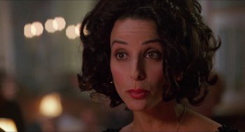 Movie still from “Super Mario Bros.” (1993), directed by Annabel Jankel – A person wearing a dress; Close Up shot, Over the shoulder angle