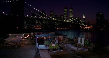 Movie still from “Super Mario Bros.” (1993), directed by Annabel Jankel – A view of a city at night with lights on; Extreme Wide shot, High angle