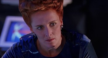 Movie still from “Super Mario Bros.” (1993), directed by Annabel Jankel – A person wearing a dress; Close Up shot, Low angle