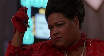 Movie still from “Super Mario Bros.” (1993), directed by Annabel Jankel – A person wearing a red shirt; Close Up shot, Low angle