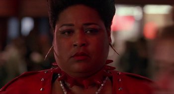 Movie still from “Super Mario Bros.” (1993), directed by Annabel Jankel – A person wearing a red shirt; Close Up shot, Low angle