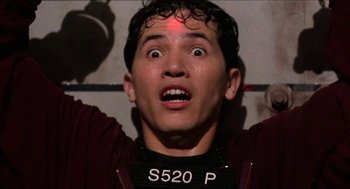 Movie still from “Super Mario Bros.” (1993), directed by Annabel Jankel – A person with a red light on his head; Close Up shot, Low angle