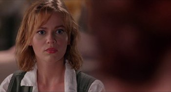 Movie still from “Super Mario Bros.” (1993), directed by Annabel Jankel – A person wearing a white shirt; Close Up shot, Over the shoulder angle