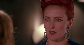 Movie still from “Super Mario Bros.” (1993), directed by Annabel Jankel – A person with red hair and green eyes; Close Up shot, Low angle