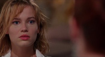 Movie still from “Super Mario Bros.” (1993), directed by Annabel Jankel – A woman's face with blue eyes; Close Up shot, Over the shoulder angle