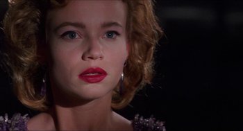 Movie still from “Super Mario Bros.” (1993), directed by Annabel Jankel – A person with red lipstick on her lips; Close Up shot, Over the shoulder angle