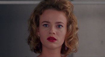 Movie still from “Super Mario Bros.” (1993), directed by Annabel Jankel – A person wearing a red lipstick; Close Up shot, Low angle