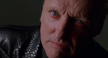 Movie still from “Super Mario Bros.” (1993), directed by Annabel Jankel – An old man with a strange look on his face; Close Up shot, Low angle