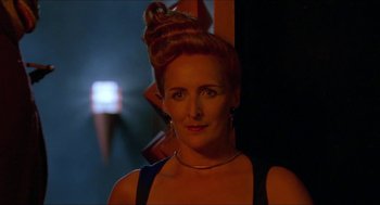 Movie still from “Super Mario Bros.” (1993), directed by Annabel Jankel – A person wearing a dress; Close Up shot, Low angle