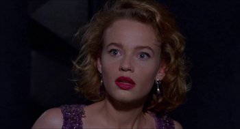 Movie still from “Super Mario Bros.” (1993), directed by Annabel Jankel – A woman with red lipstick looking at the camera; Close Up shot, Low angle