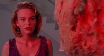 Movie still from “Super Mario Bros.” (1993), directed by Annabel Jankel – A person in a room near a wall; Close Up shot, Low angle